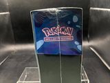 someone is holding a pokemon trading card in front of a display case