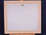 an easel with a white canvas on a blue background