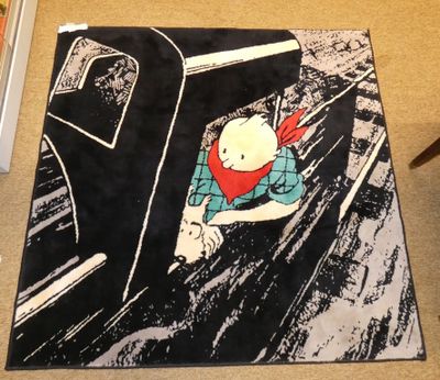 un tapis sur lequel est représenté un chat dans une voiture
