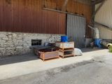 an image of a building with a lot of furniture outside