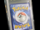 a pokemon card in a plastic case on a black background