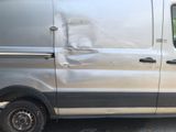 a van that has been vandalized and is parked on the side of the road
