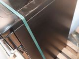a small refrigerator that is sitting on a pallet