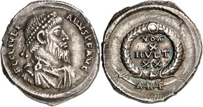 a silver coin with an image of a woman on it