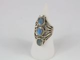 a close up of a silver ring with blue stones on it