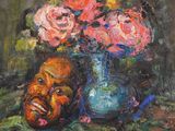 a painting of a man ' s face next to a vase of flowers