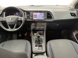 the interior of a car with a steering wheel, dashboard, and dashboard controls