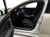 a car with the door open and the driver ' s seat down