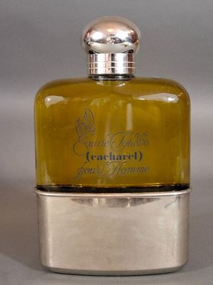 a small bottle of perfume sitting on a table