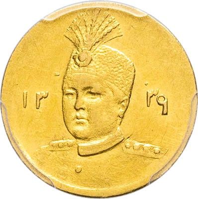 an image of a gold coin with a picture of a man with a mohawk on it