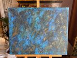 a painting that is on a easel in a room