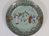 a plate with a painting on it on the wall