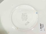 a white plate with a picture of a castle on it