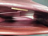 a close up of a brown purse with a handle