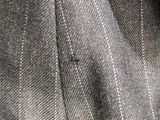 a close up of a suit with a tie on it