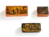 three small wooden boxes with paintings on them on a white surface