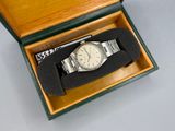 a watch sitting in a box on a table