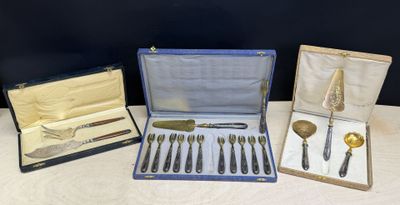 several different types of silverware are in a case on a table