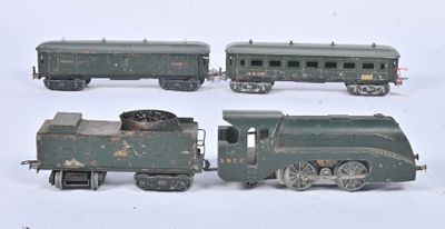 four toy trains sitting on a white surface