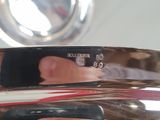 a woman taking a picture of her reflection in the mirror