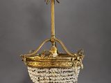 a gold and crystal chandelier hanging from a ceiling