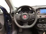 the interior of a small car with a steering wheel and dashboard