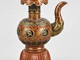 an image of a red and gold vase with a snake on it