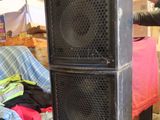 a man that is standing next to a speaker