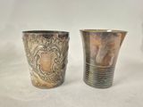 pair of antique silver plated vases on a white background