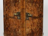 an image of a wooden cabinet with two doors and a black marble top