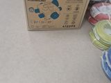 a box of hydrocopy flex tape on the floor next to a pile of other items