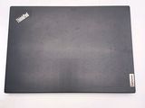 a laptop that is sitting on a white surface