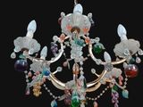 a chandelier with a bird on top of it