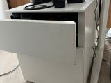 a white desk with a computer on top of it