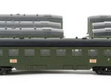 three green train cars sitting next to each other on a white surface