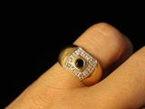 a person ' s hand with a ring on it ' s finger