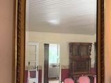 a mirror hanging on the wall in a living room