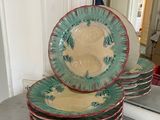 many plates stacked on top of each other on a counter