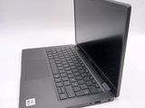 a black laptop with a black keyboard on a white surface