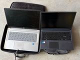two laptops that are open on the floor