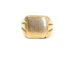 an image of a gold ring with a stone in the middle of it