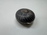 a black and silver box on a white table