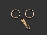 a pair of gold hoop earrings and a gold clasp