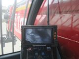 a view of a bus from inside of a vehicle