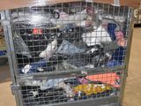 a metal cart with many items in it in a warehouse