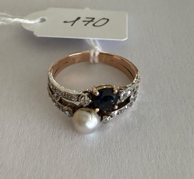 a close up of a ring on a white surface with a price tag