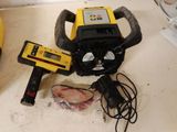 a yellow and black machine on a counter next to a banana