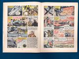 an old comic book opened to a page with a picture of a plane