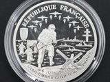 a close up of a silver coin with a picture of a man on it