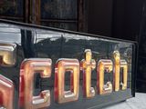 a picture of a sign that is sitting on a table
